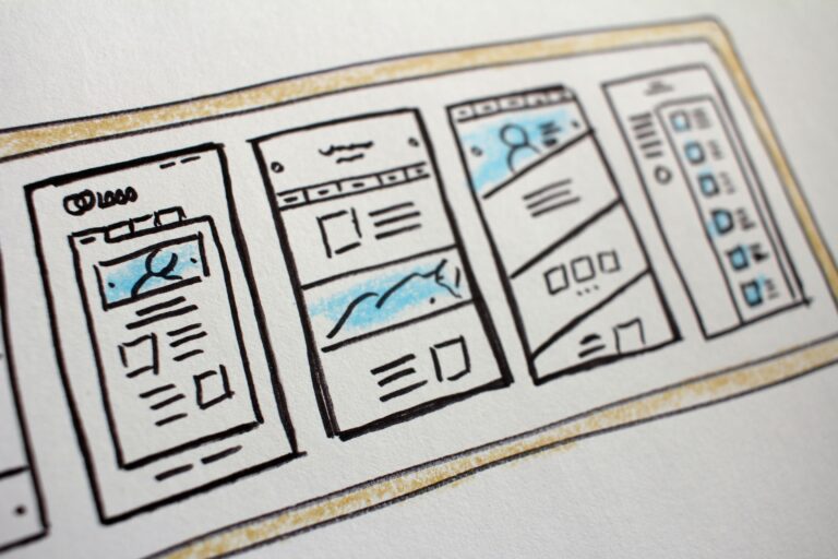 a piece of paper with web design mockups